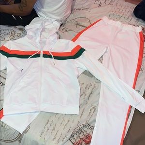 2 piece red and green track suit.